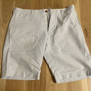J Crew shorts white with blue stripe and brown buttons.